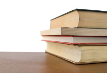 four books over desktop
