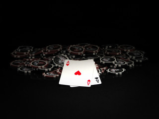 Black and red poker chips and aces