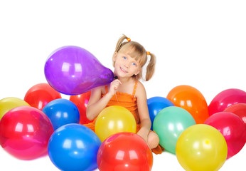 Fototapeta na wymiar Cute little girl playing with baloons