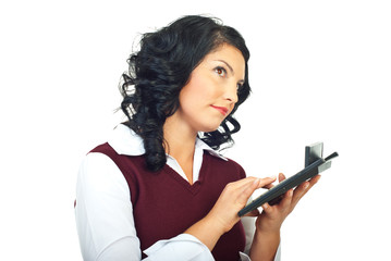 Fototapeta premium Thinking woman using calculator