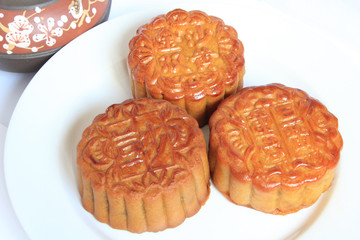 Moon cakes with Chinese teapot close up view