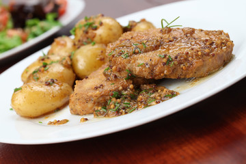 Roast pork with baby potatoes