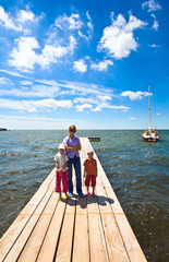 Family on wooden pier