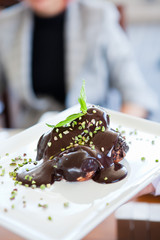 Pastry garnished with chocolate sauce