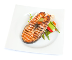 Grilled salmon with salad in plate