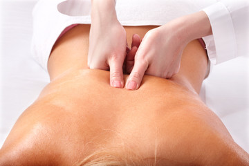 Massage of female back. Spa.