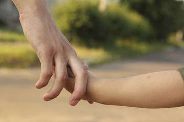 Man keeps hand a child