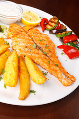 Salmon steak with roasted vegetables