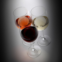 Closeup of glasses full of wine on grey background