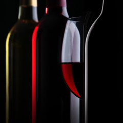 Bottles of wine on black background