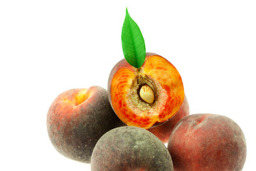 peaches with green leaf isolated on white