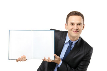 Businessman showing a white blank book