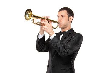 Man in a suit playing a trumpet