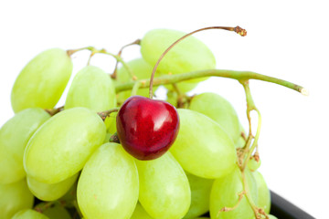 grapes and cherries isolated on white