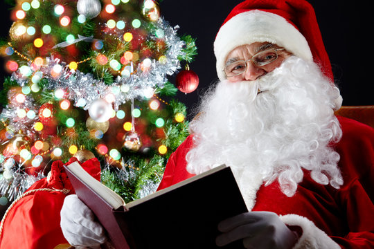 Santa Reading A Book