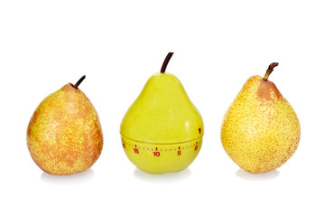 Two ripe fresh pears and green plastic pear timer