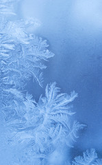 Fairy-like sparkling winter background (frosted window)