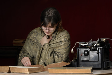 Fototapeta na wymiar woman with glasses reading antique books