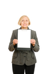 Portrait of a happy senior woman holding clipboard