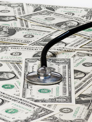 A medical stethoscope and dollar