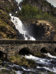 Fototapeta na wymiar Waterfall and bridge