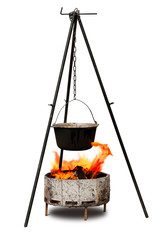 Cooking in old cast-iron on tripod isolated over white