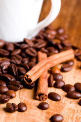 coffee beans, cup and cinnamon