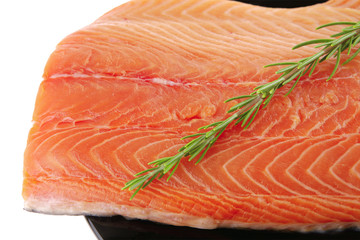 fresh uncooked red fish fillet and rosemary