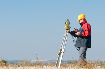 surveyor theodolite worker
