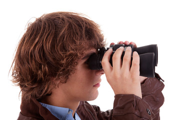 Young boy looking through binoculars