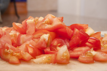 closeup of freshly peeled sliced tomatoes.
