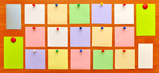 bulletin board with colorful paper notes