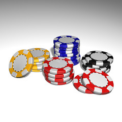 Poker Chips on the white table