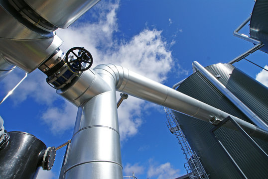 Industrial zone, Steel pipe-lines on blue sky