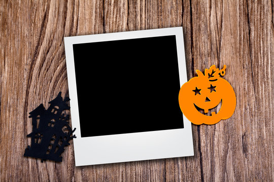 Photo with halloween icons over wood background