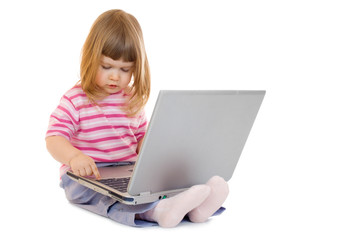 Naklejka premium Little girl with laptop