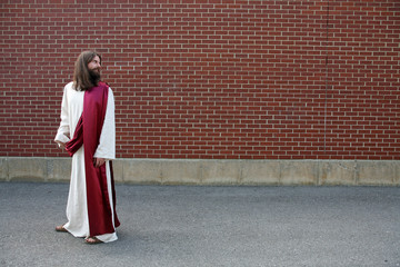 Jesus looking over his shoulder at blank wall