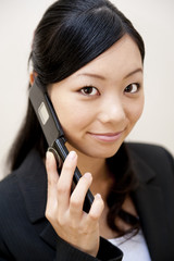 portrait of japanese business woman spearking on mobile phone