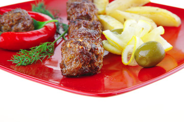 roast cutlets on red dish