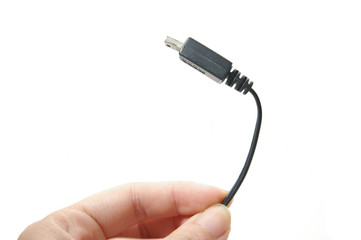 A hand holds an isolated usb connector