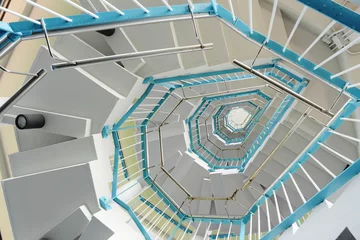 Selbstklebende Fototapeten spiraling stairs © leungchopan