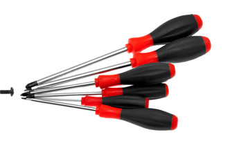 Several screwdrivers trying to tighten one screw