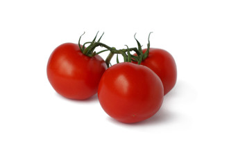 Three ripe red tomatoes on white background