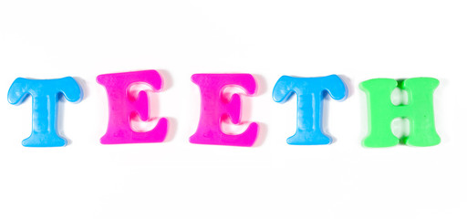 teeth written in fridge magnets