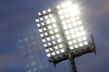 Stadium lights and dark blue sky