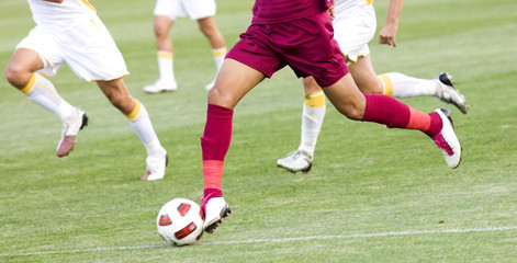 Fototapeta premium Soccer player running after the ball