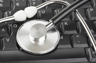 Stethoscope and computer keyboard