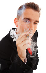 Young man in smoke cloud