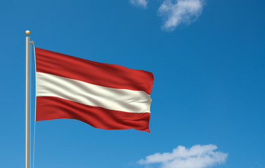 Flag of Austria waving in the wind in front of blue sky