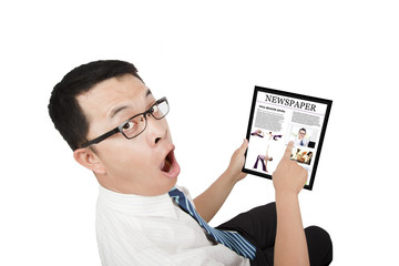 surprised Businessman using a touch pad pc